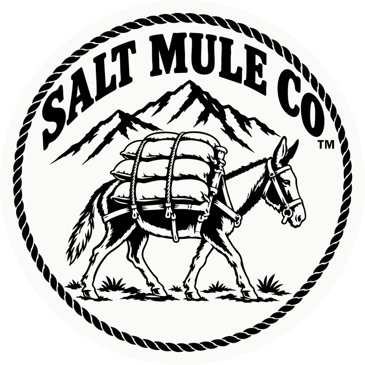 Salt Mule Co logo: a pack mule carrying salt sacks past the mountains